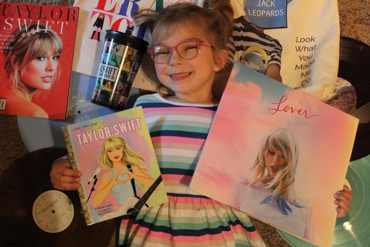 Linn+pictured+with+some+Taylor+Swift+merch.